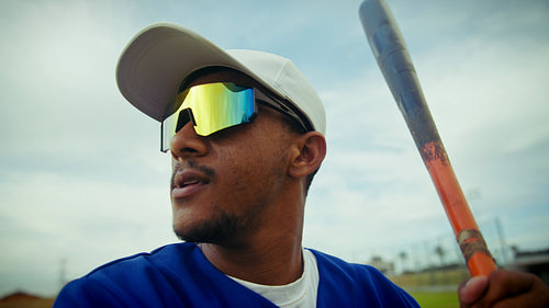 Focused baseball batter prepares for a powerful swing
