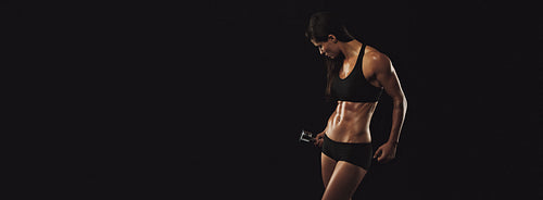 Muscular female doing bodybuilding training