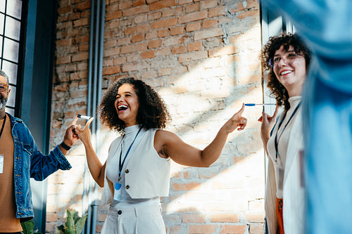 Teambuilding workshop enhancing confidence and trust amongst diverse team members in modern workspace