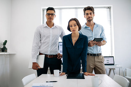 Business colleagues standing in meeting room