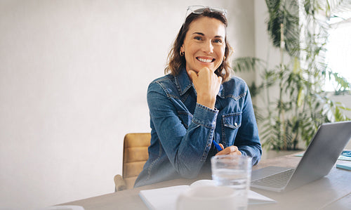 Happy and Successful Businesswoman in Her Office