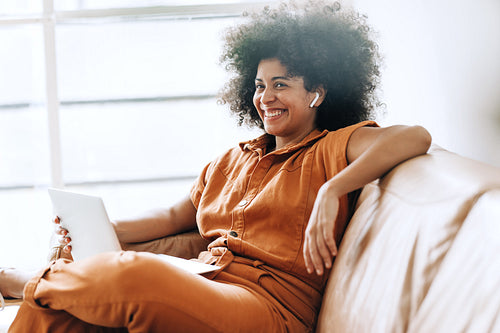 Black businesswoman smiling happily during a video call