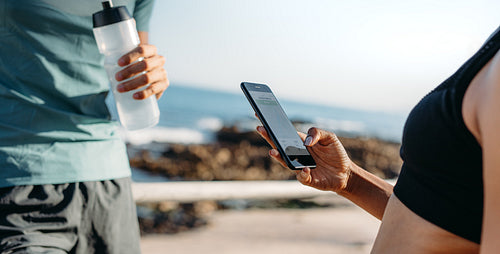 Close up of fitness couple taking a break after workout