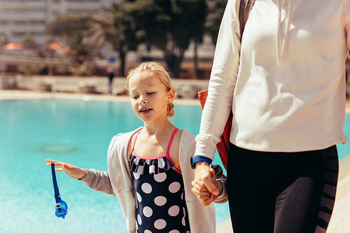 Mother and daughter going home after swimming