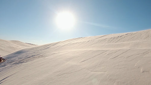 Motorcyclist creating dust in a desert
