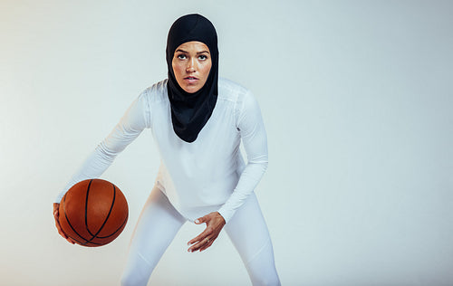 Close up woman playing basketball