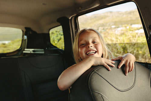 Beautiful girl travelling by a car