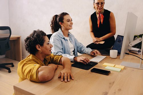 Small business team collaborating in a creative modern office setting