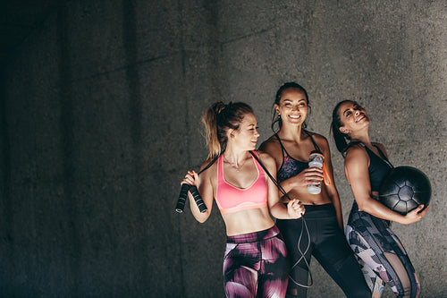 Group of female friends relaxing after workout