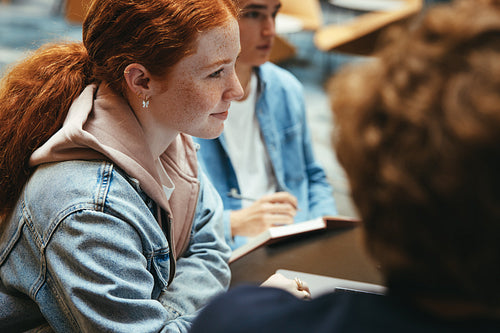 Girl student with classmates in college campus