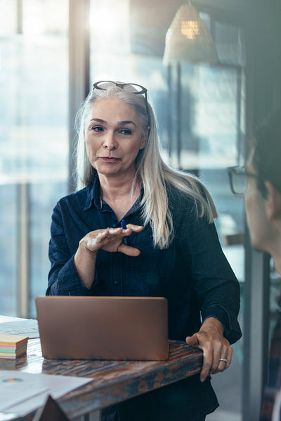 Female manager having a meeting with her team at office
