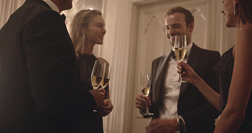 Group of people at a celebration event drinking wine