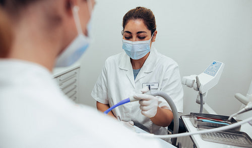 Nurse assisting doctor in dentistry