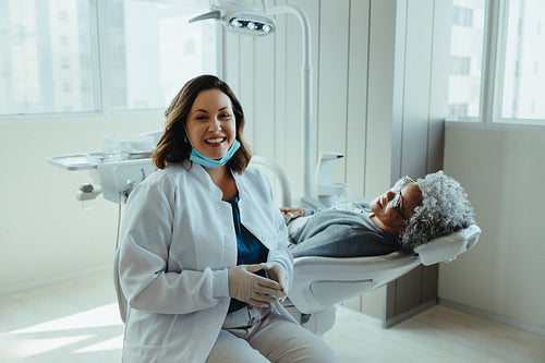 Dentist greets her patient as healthcare begins in the clinic