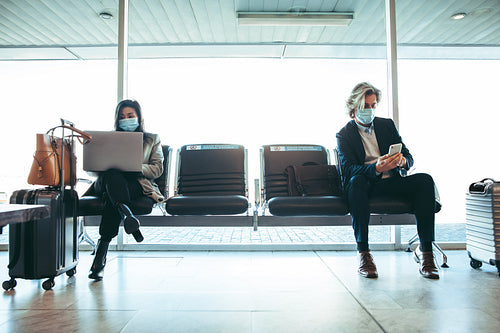Business people waiting for flight at terminal
