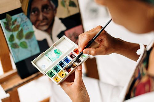 Anonymous young painter working on a new project