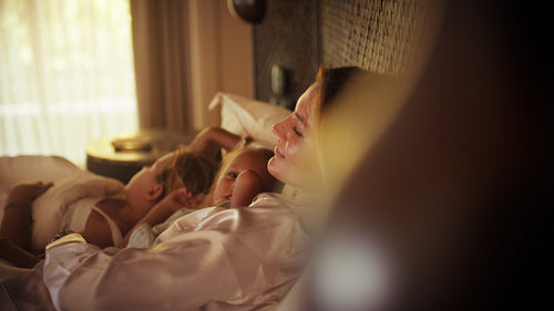 Peaceful morning for a mother and her children on a relaxing luxury resort vacation