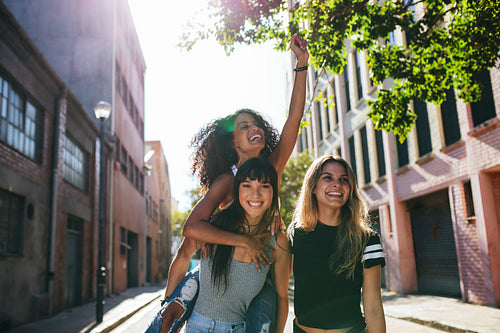 Happy young women enjoying on city street