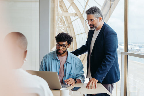 Diverse business team collaborating in a professional boardroom