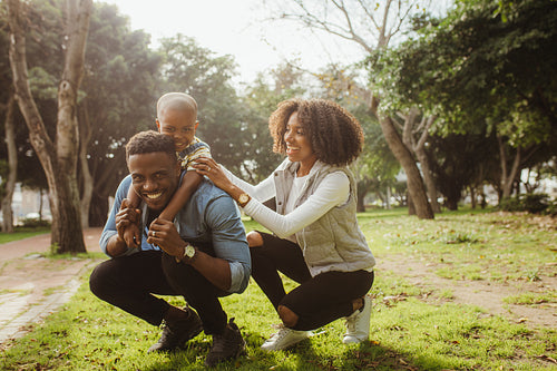 Happy young family enjoying at the park