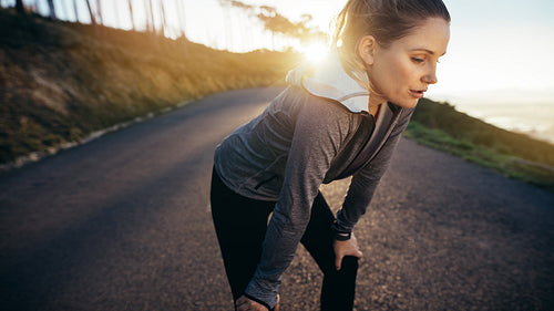 Fitness woman taking a break during fitness running