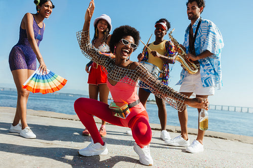 Beach party with friends at carnival celebration