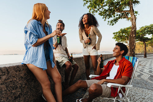 Friends chilling at Urca's Wall enjoying a relaxed outdoor afternoon
