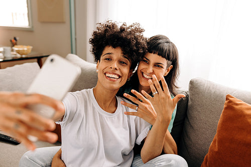 Newly married lesbain couple video calling their friends