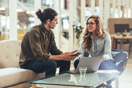 Businesswoman discussing work with a business partner