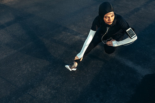 Muslim woman doing exercise in morning.