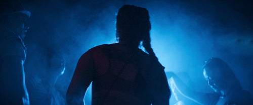 Vibrant group of diverse friends dancing at a music festival