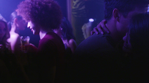 Romantic young couple dancing at discotheque