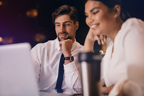 Business people waiting at airport lounge using laptop