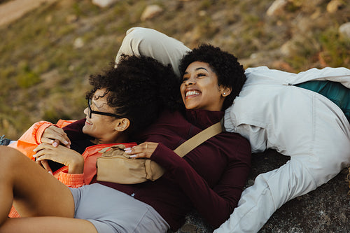 Friends relaxing and laughing outdoors