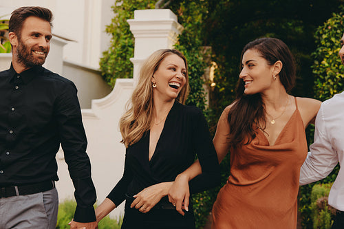 Couples arriving at a luxury hotel