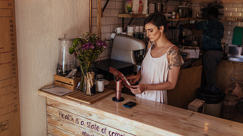 Woman entrepreneur at her coffee shop
