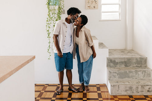 Mature couple smiling and expressing their love for each other at home