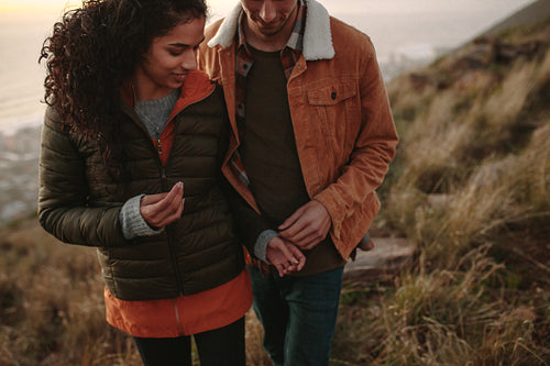Romantic couple hiking on mountain trail