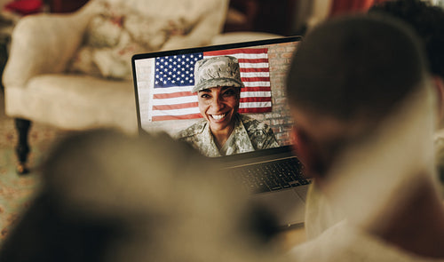 American servicewoman video calling her family