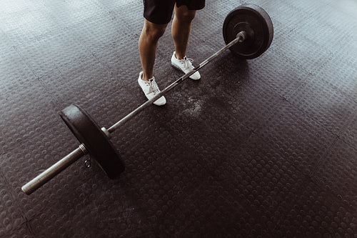 Male athlete exercising with heavy weights