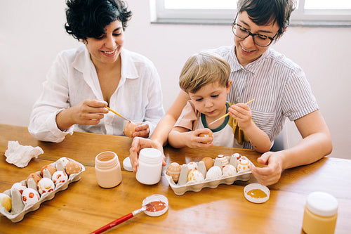 LGBT family painting Easter eggs