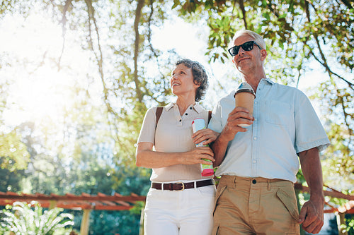 Senior tourists walking through a park