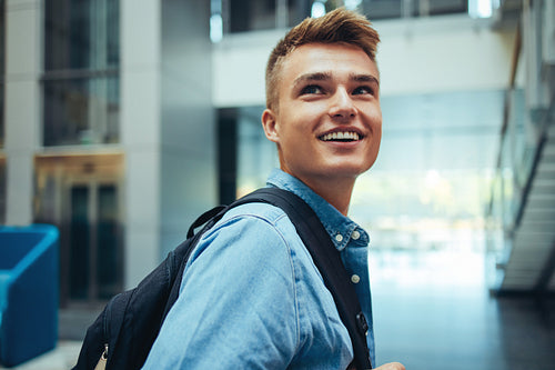University student looking back and smiling