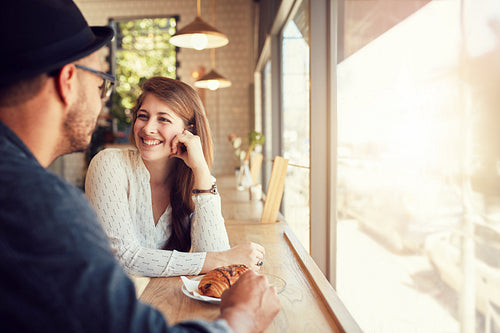 Happy young couple at coffee shop