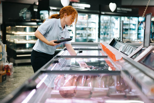 Woman working in grocery store