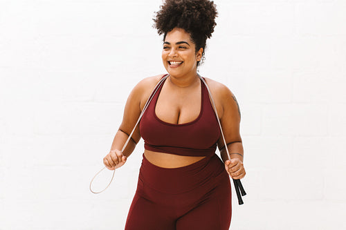 Body positive woman with skipping rope