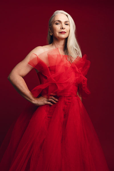 Glamorous senior woman in red dress