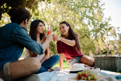 Young people having beers at park