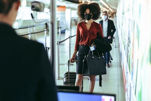 Thermal scanning of passenger at departure gate in airport