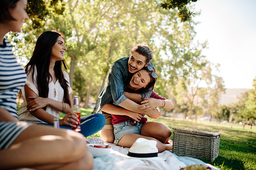 Friends hanging out at park